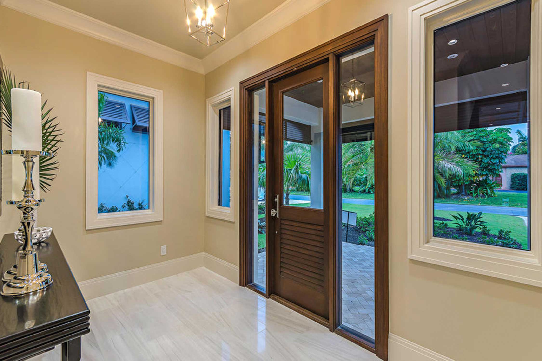 Front entry of Naples, Florida home featuring Andersen windows & doors